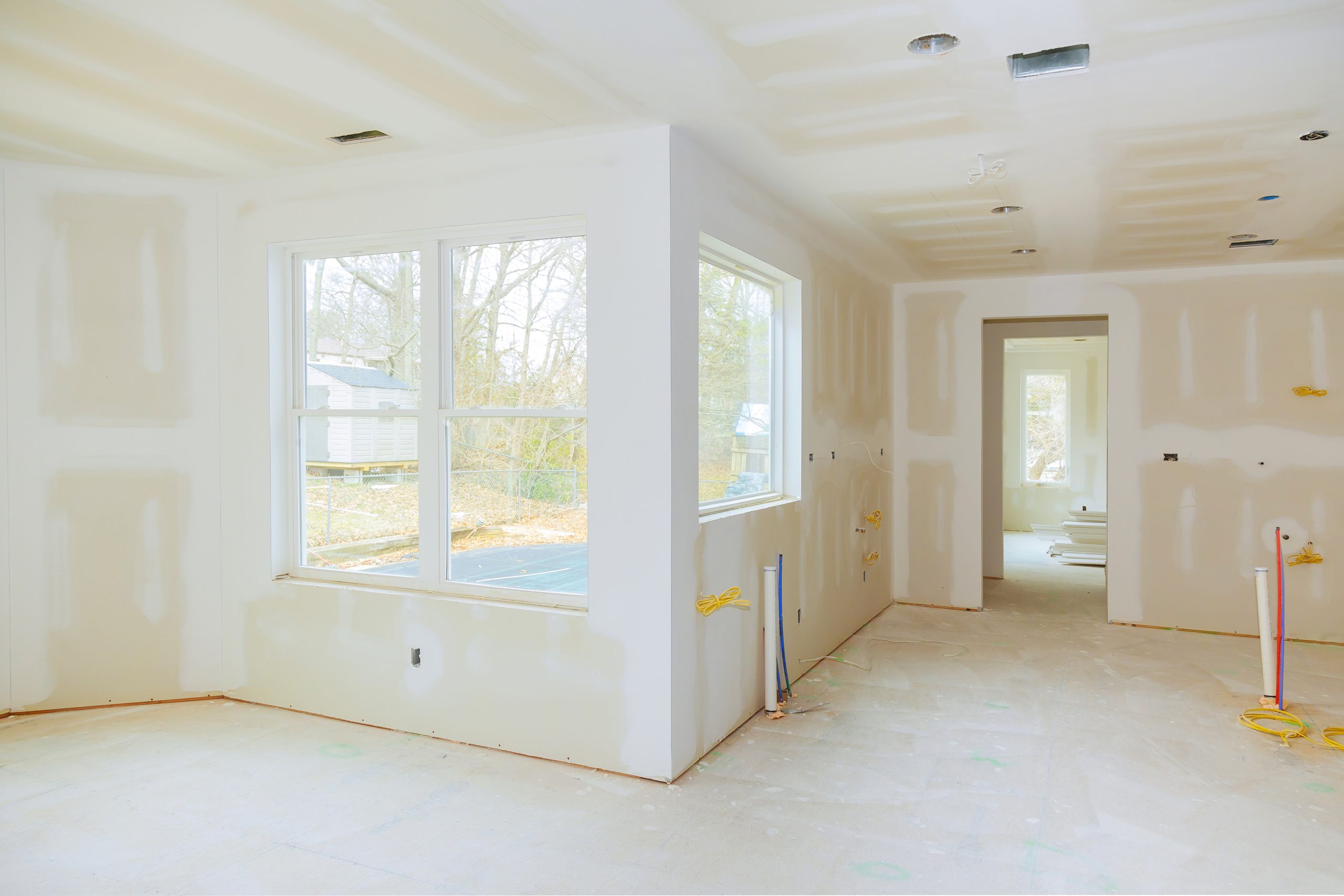Interior,Construction,Of,Housing,Project,With,Drywall,Installed,And,Patched